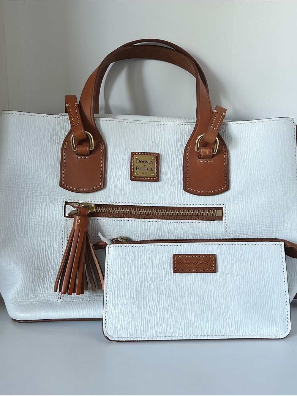 Dooney & Bourke White and Brown Leather Satchel with Tassel
